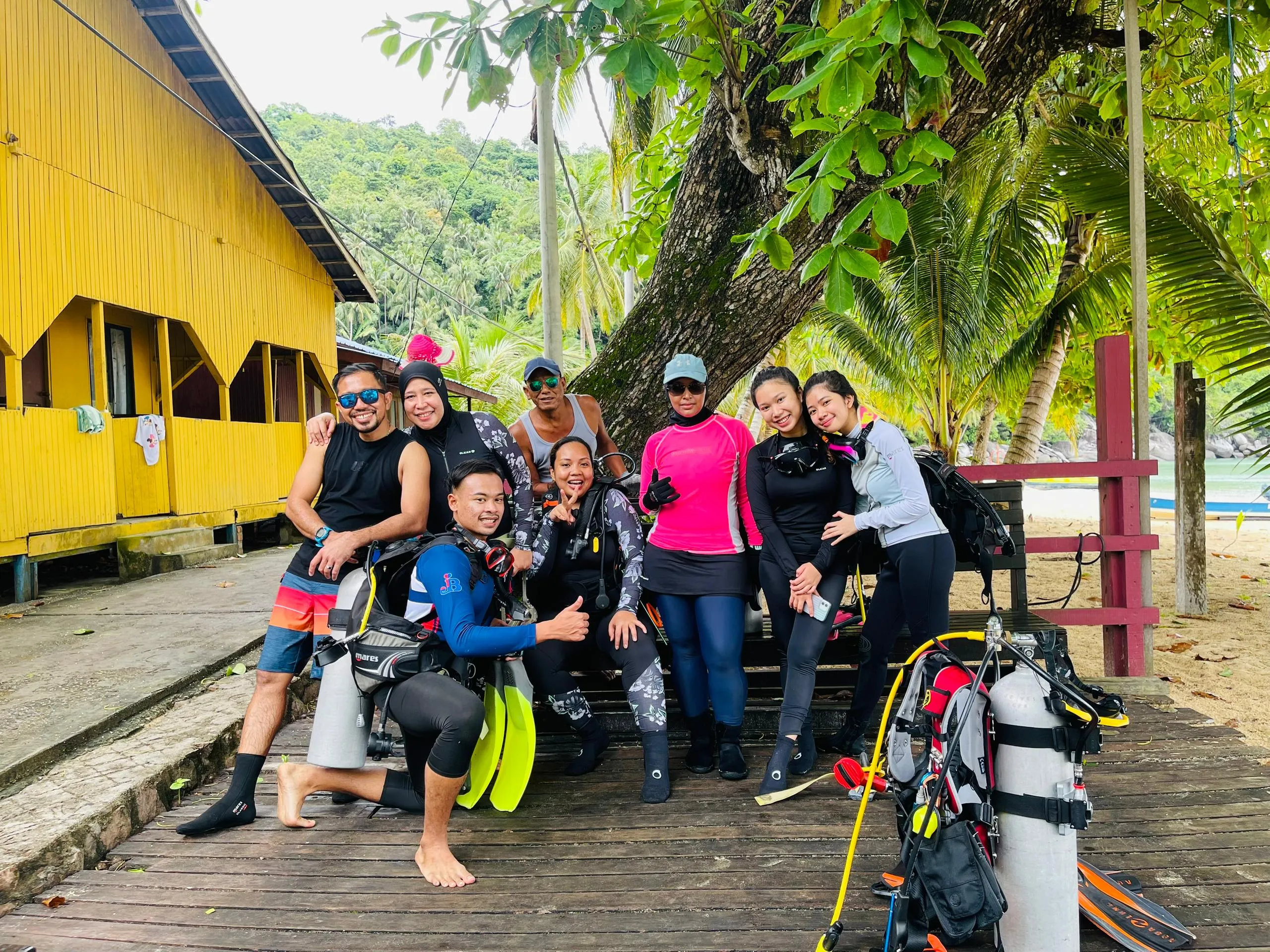 Dive team by bright yellow lodge