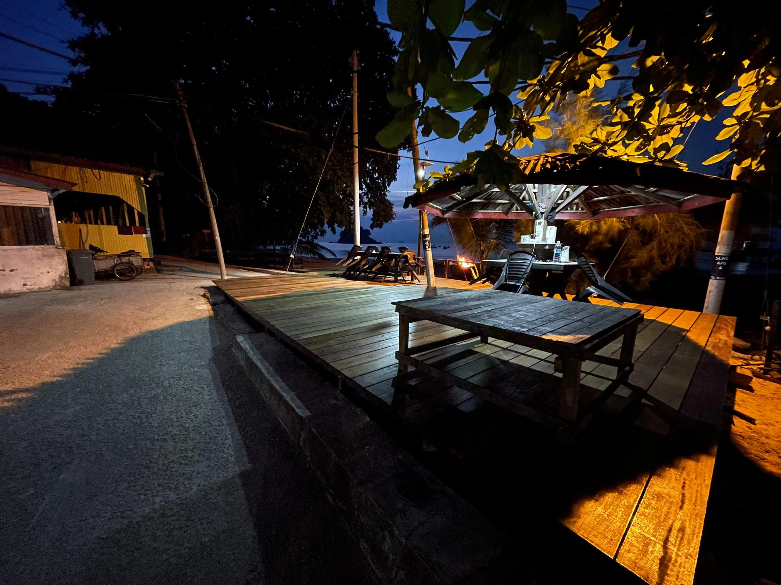 Night deck lights by the beach